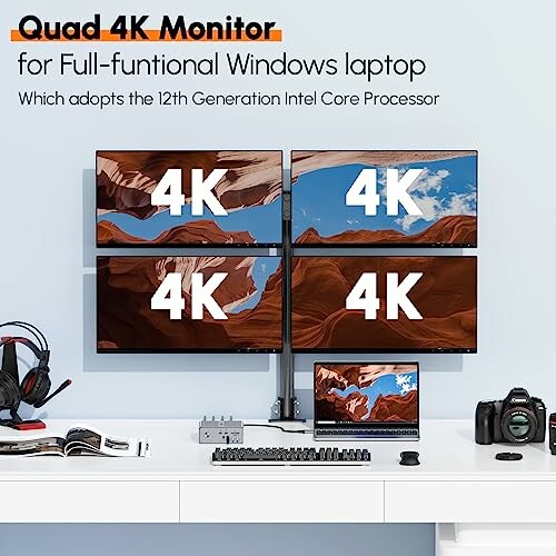 Quad 4K monitors setup on a desk with tech gadgets.