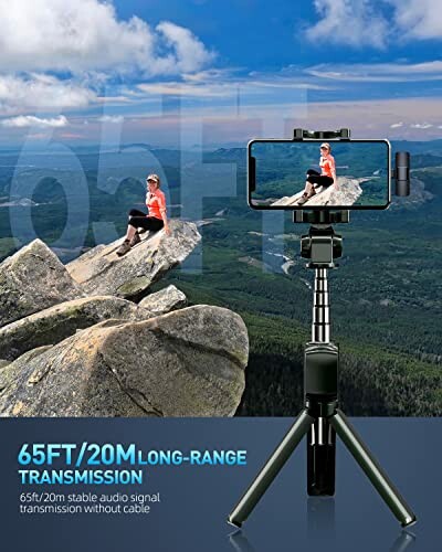 Person on mountain with smartphone on tripod.