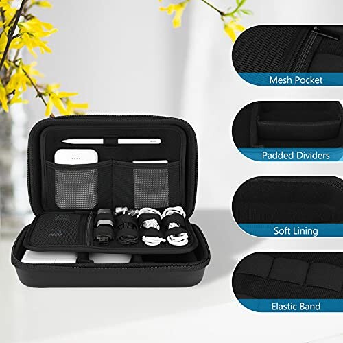 Open travel electronics organizer with mesh pocket, padded dividers, soft lining, and elastic band.